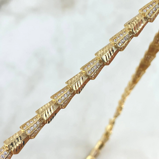 Cadena Serpiente Escamada | Oro Amarillo +4 | 32.55gr | 50cm | Circones Blancos Ojos Verdes